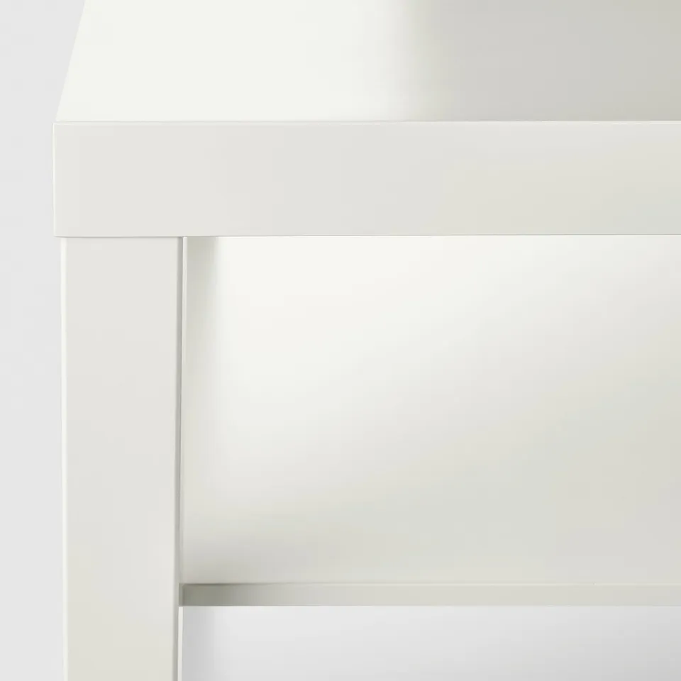 Modern white side table with sleek lines and durable finish.