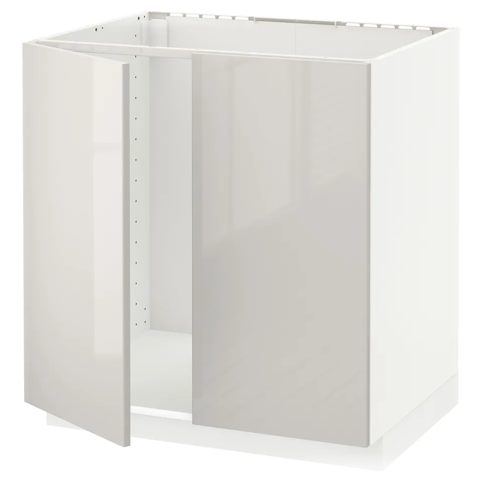 A white METOD kitchen cabinet in a modern design with a glossy finish.