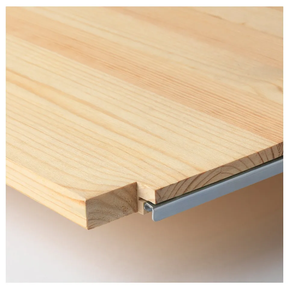 Close-up of a light-colored wooden surface, showcasing its smooth texture and craftsmanship.