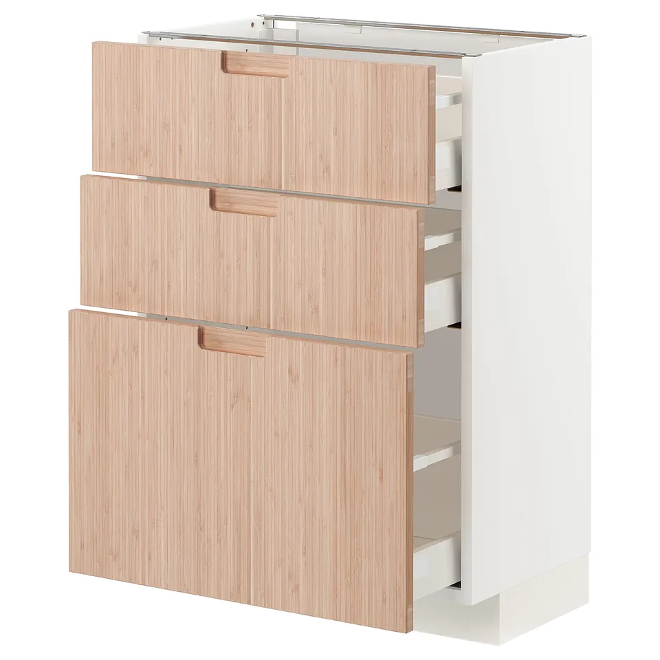 White kitchen cabinet with open drawers.