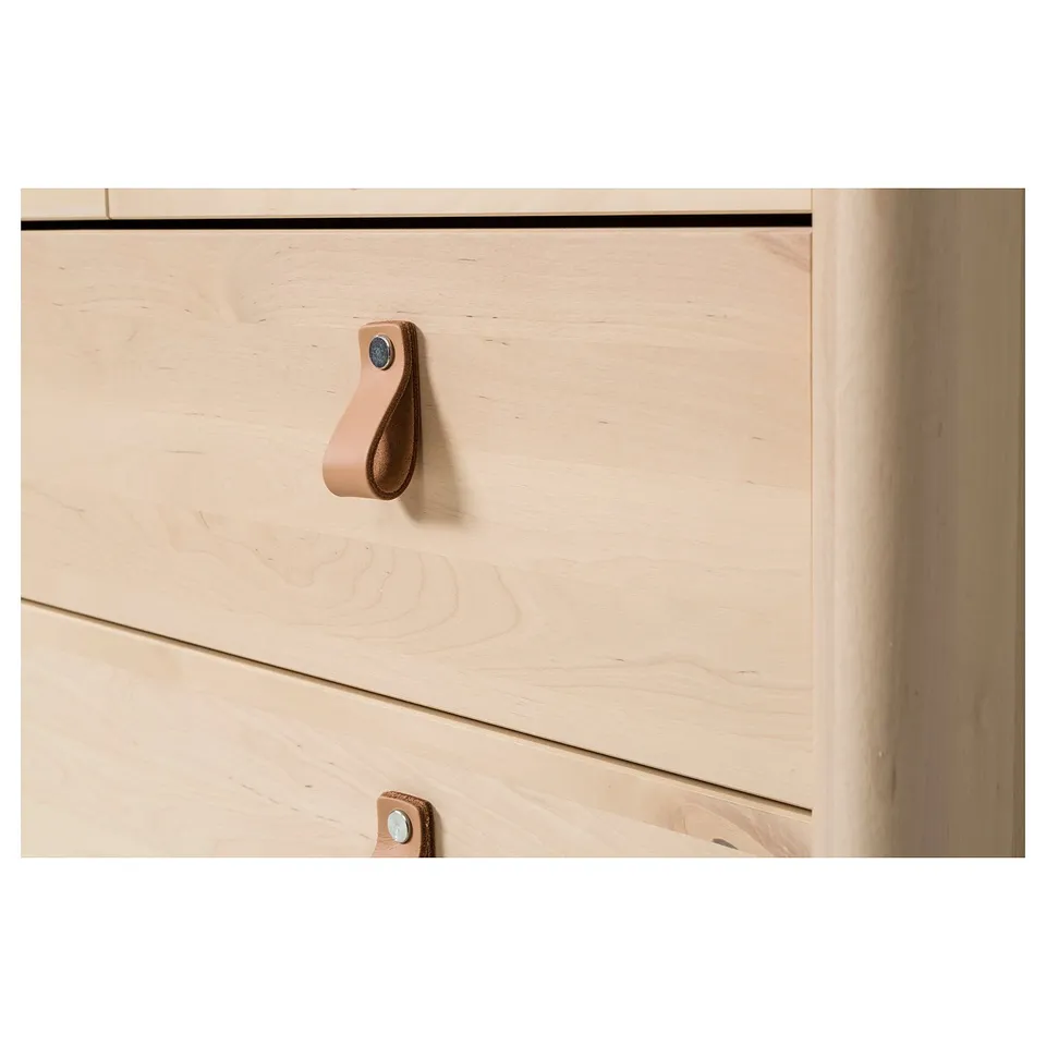 Light wood dresser with leather handles, quality craftsmanship visible.