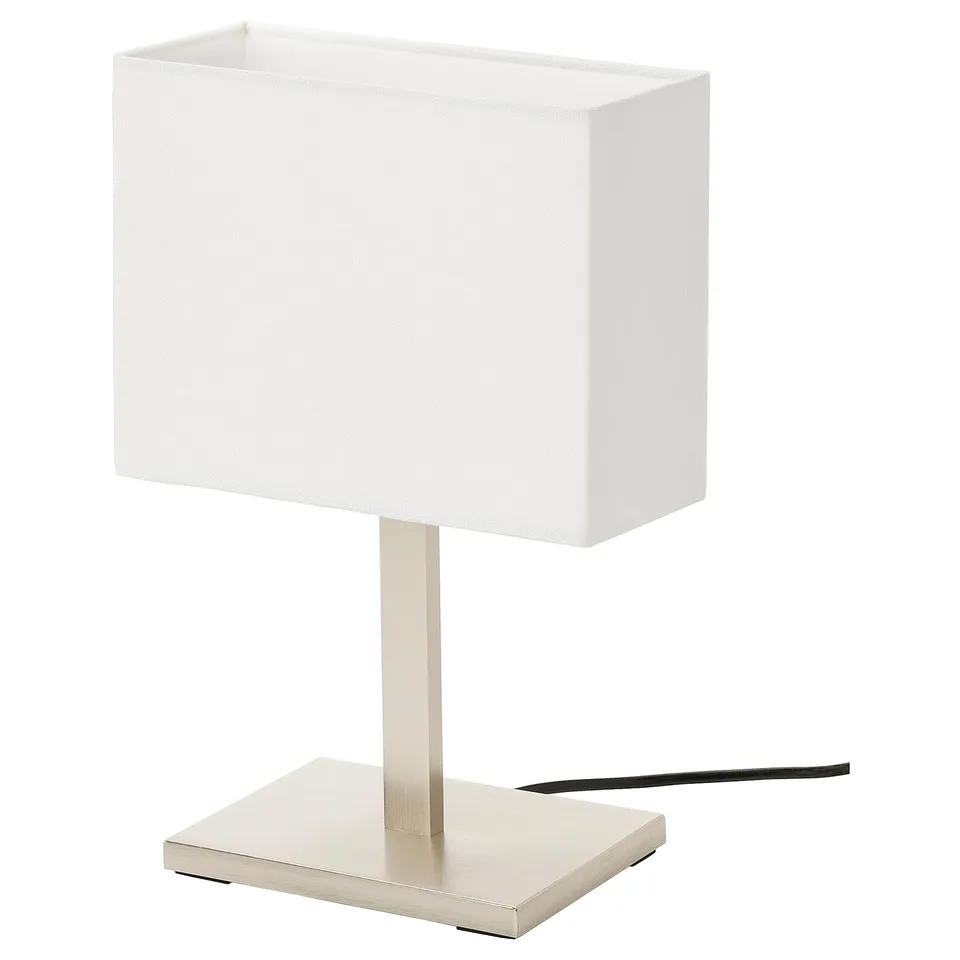 A TOMELILLA table lamp with a white shade and silver base.