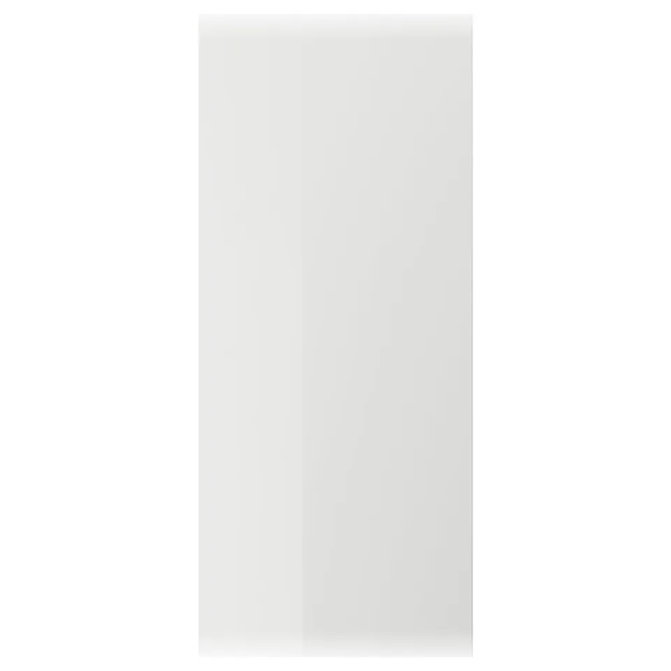 White RINGHULT kitchen cabinet door, glossy and sleek.