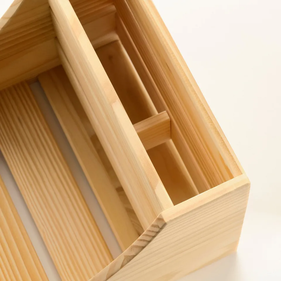Natural wood kitchen organiser with compartments. Crafted from solid pine, lightweight, durable, and renewable.