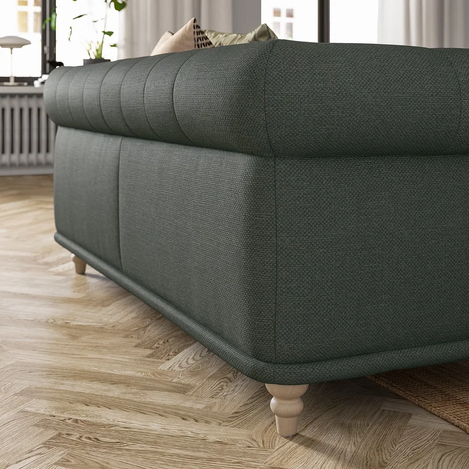 Dark grey VISKAFORS sofa, classic design with soft, rounded shapes, wooden legs, cotton-polyester cover. Cosy and inviting for living rooms.