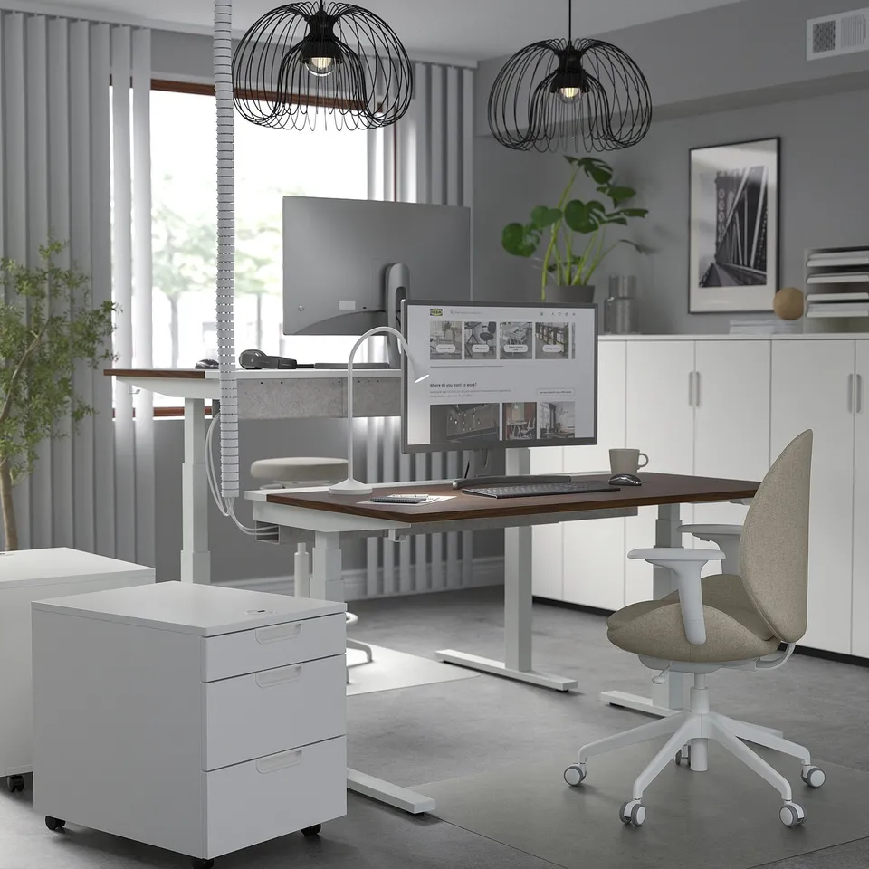 MITTZON sit/stand desk with dual motors, grey chair, drawers. Modern, adjustable, ergonomic.