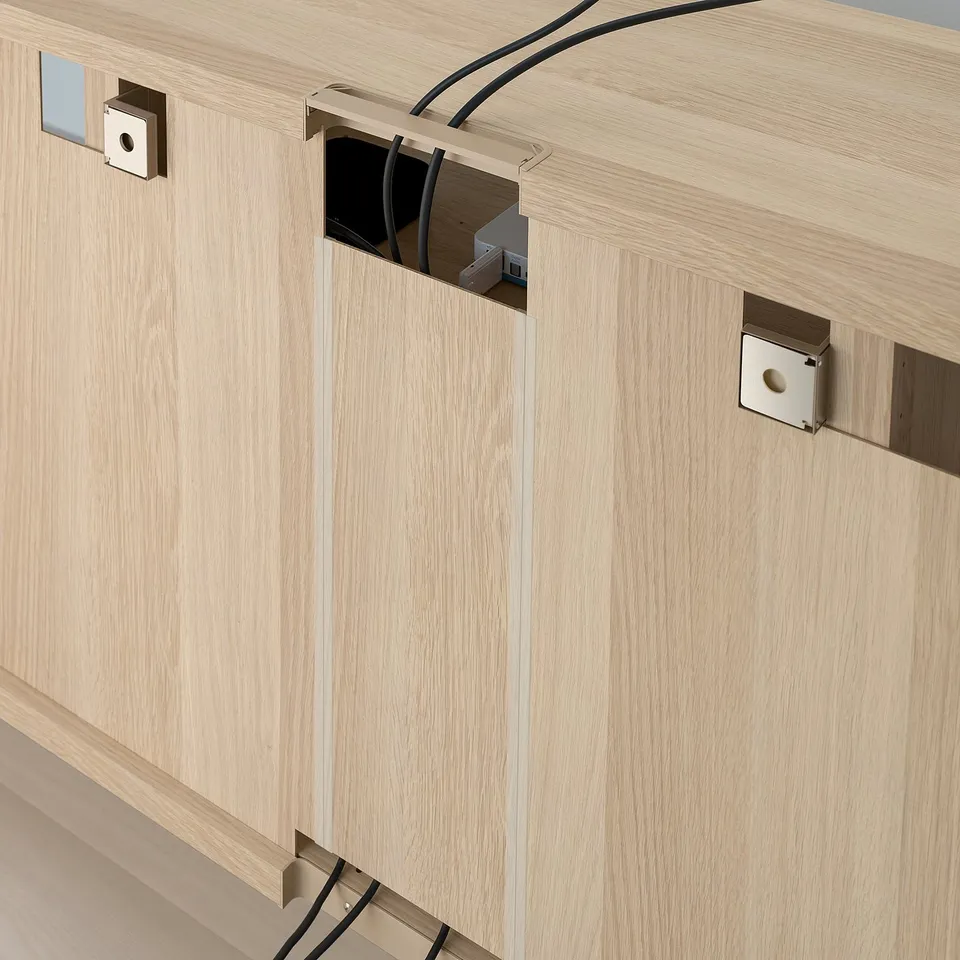 Wooden BESTÅ tv unit with cable management, adjustable shelves, and soft-close drawers.