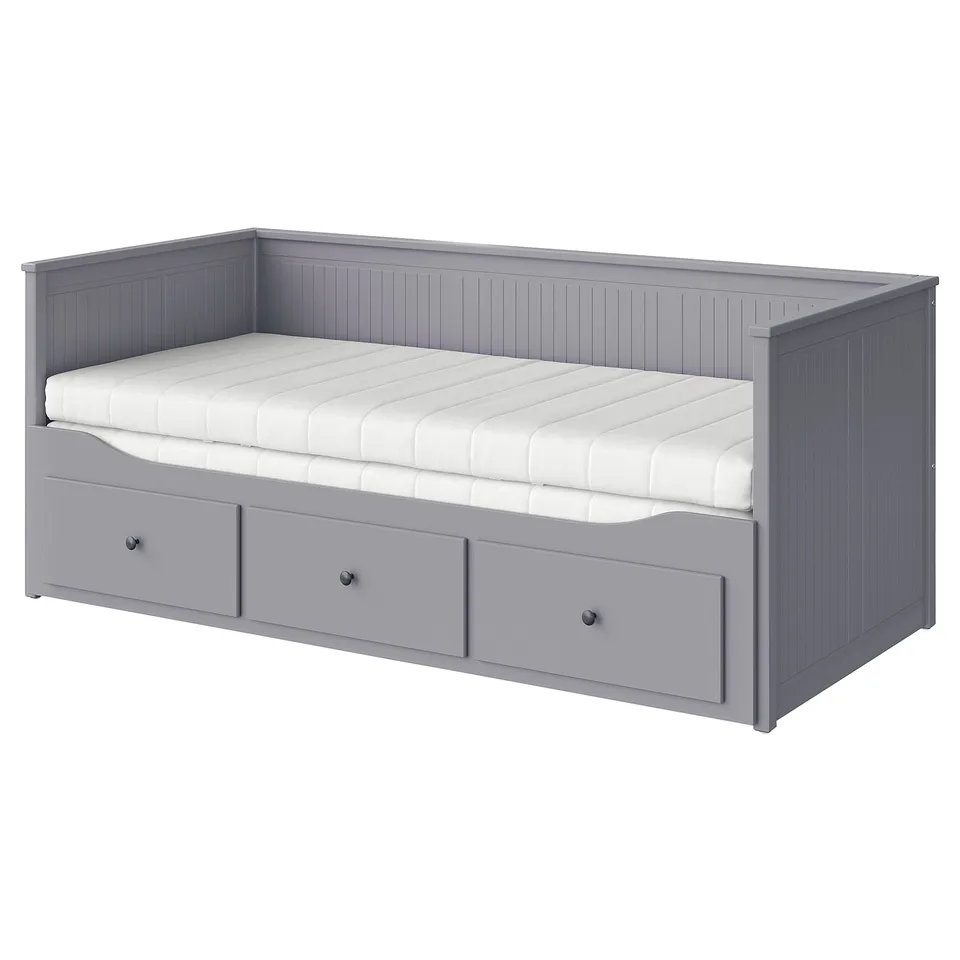 Grey HEMNES bed with drawers, foam mattress, wooden frame, rectangular shape.