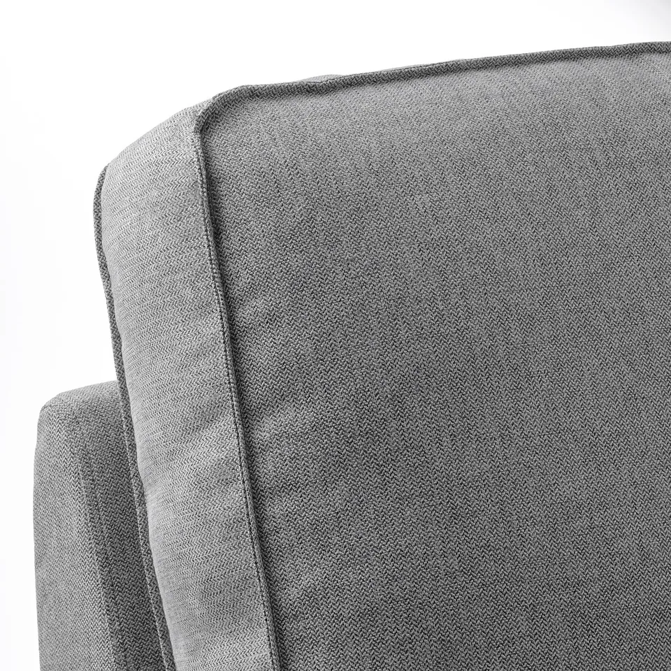 Close-up of luxurious grey KIVIK chaise longue, showcasing plush, textured fabric and sleek design.