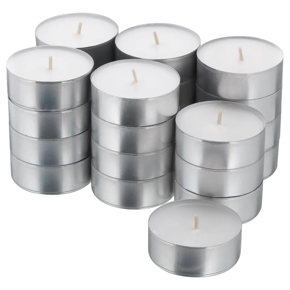 Pile of white candles in silver cups, stacked in groups, typically used for decoration and ambiance.