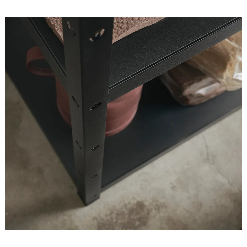 Black metal storage shelf unit with red and clear items.