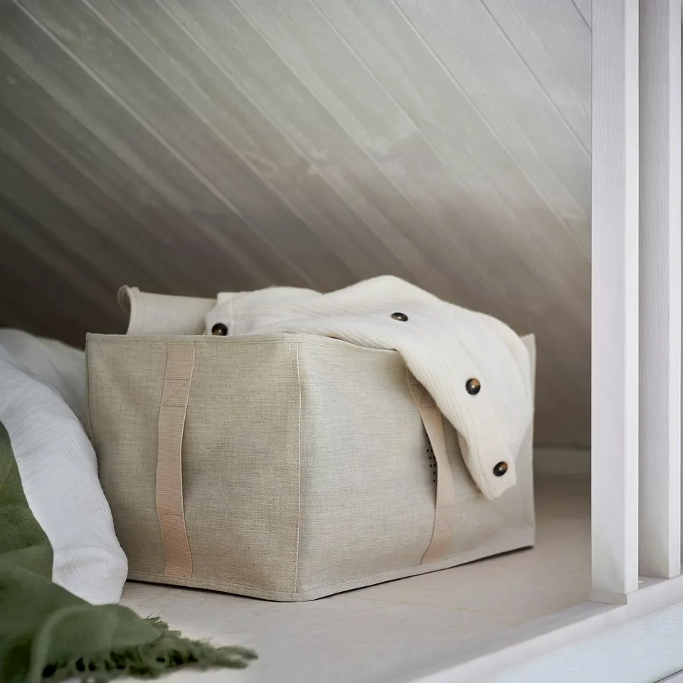 Beige fabric storage bin with handles for clothes/bedding, pax wardrobe compatible.
