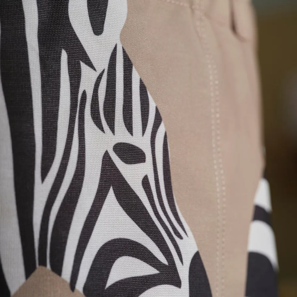 Close-up of durable, patterned storage bag with light beige accents. Shows intricate stitching and robust material.