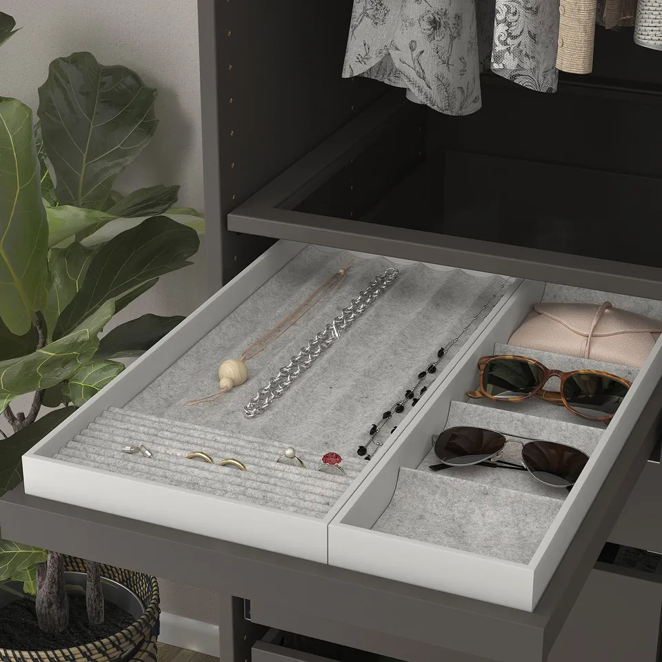 A drawer organiser with compartments jewellery and accessories. A felt lining to protect items and pull-out tray with rails.
