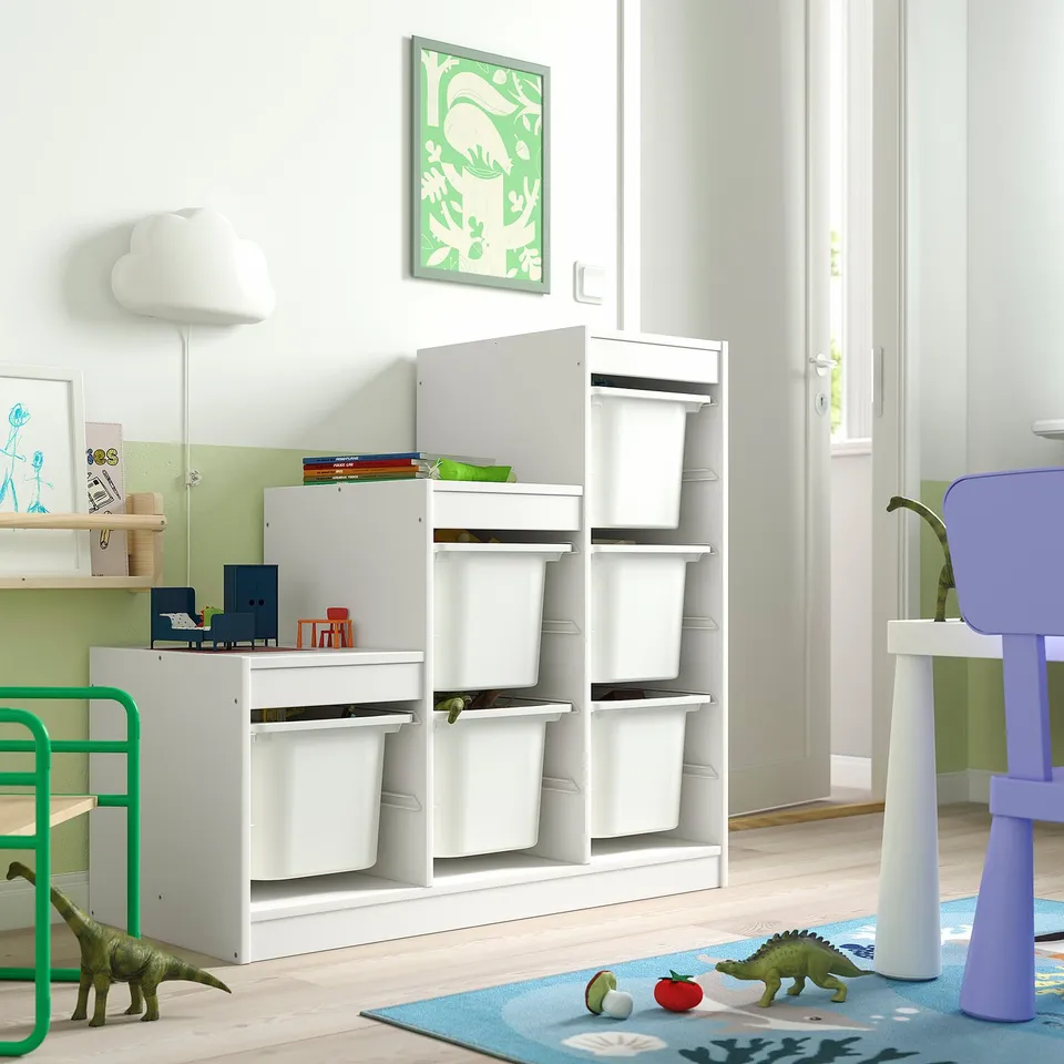 TROFAST storage in kids room with green walls; grey bins hold toys & supplies.