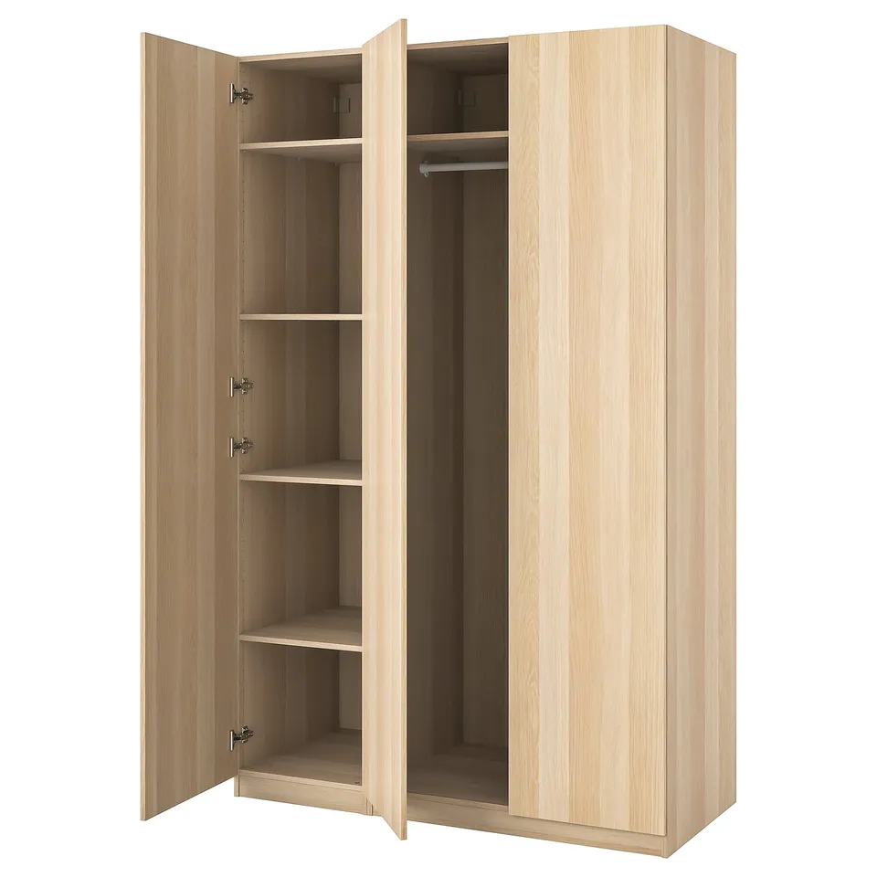 A light brown, wooden PAX wardrobe with two open doors, revealing multiple shelves and a clothes rail inside.