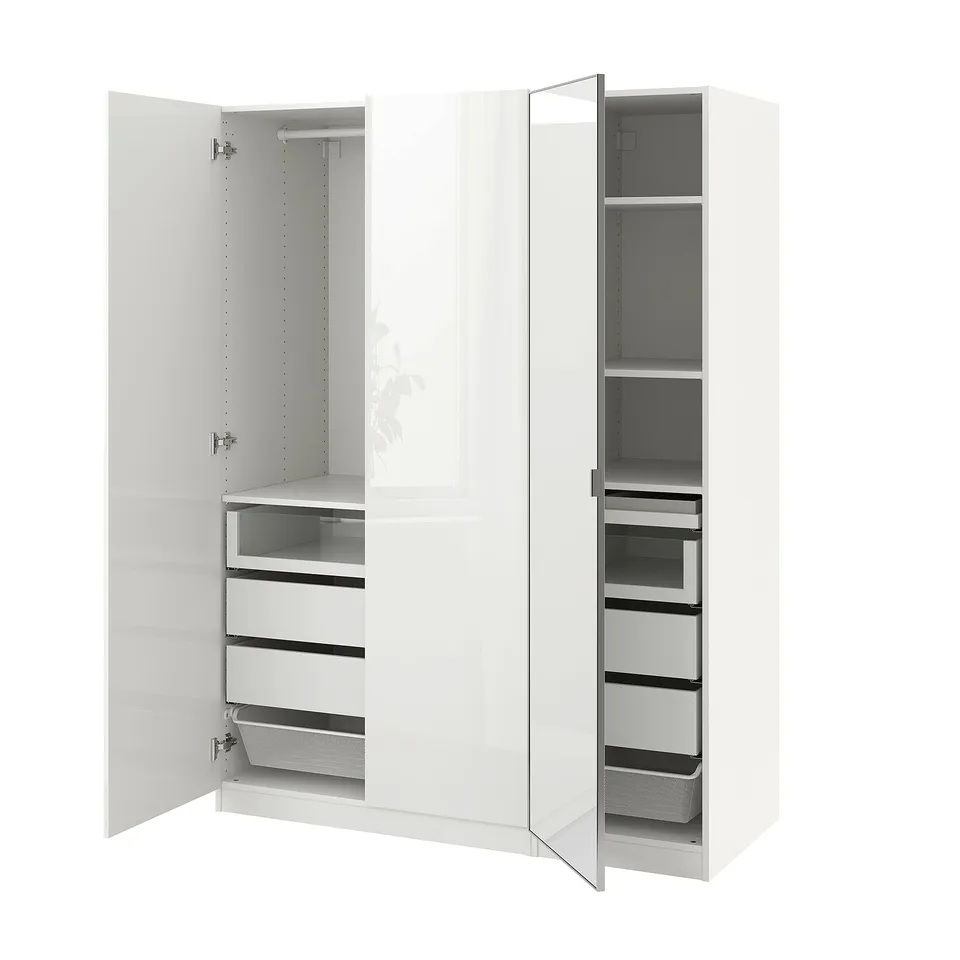 A white PAX wardrobe with mirrored doors, featuring shelves and drawers for storage.