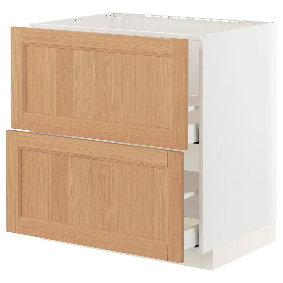 Modern white kitchen cabinet with oak drawers and door.
