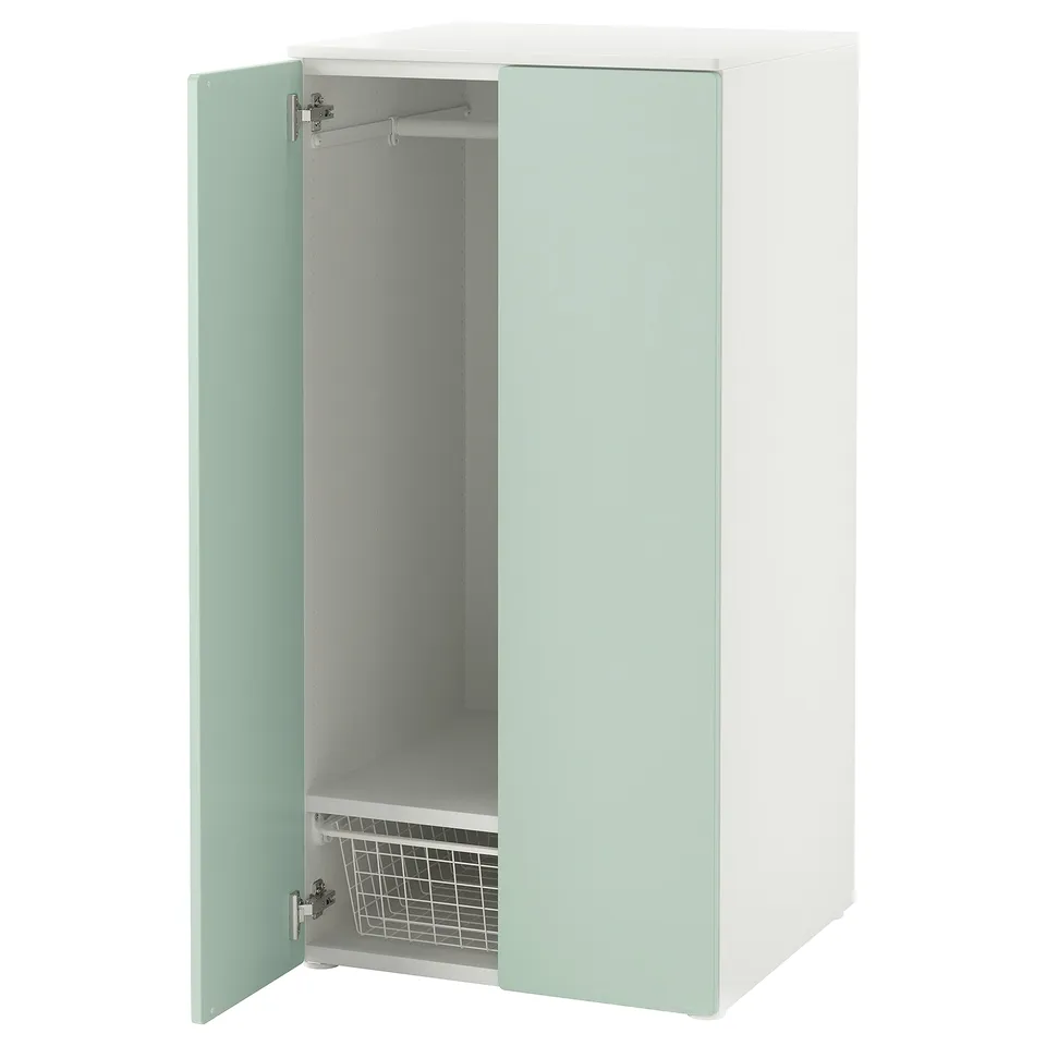 An a tall, light green SMÅSTAD cabinet with one door open revealing a shelf and hanging rail.