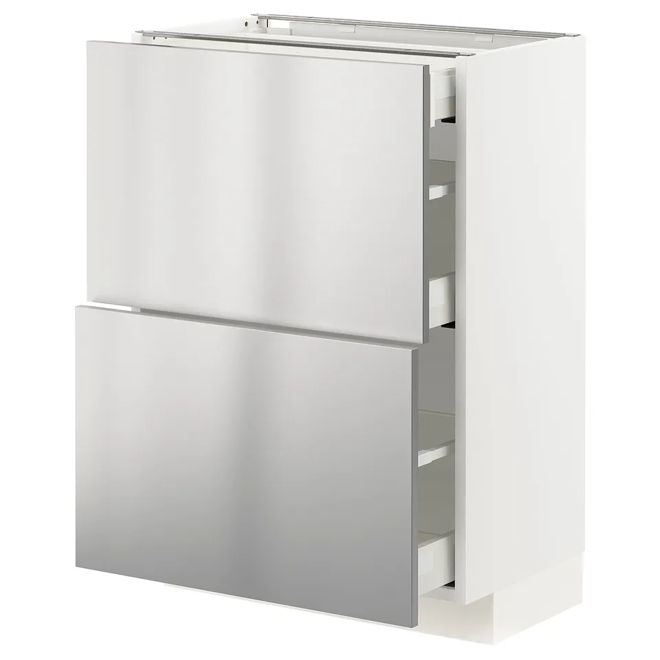 A white METOD kitchen cabinet with stainless steel vårsta fronts, showcasing sleek drawer designs.