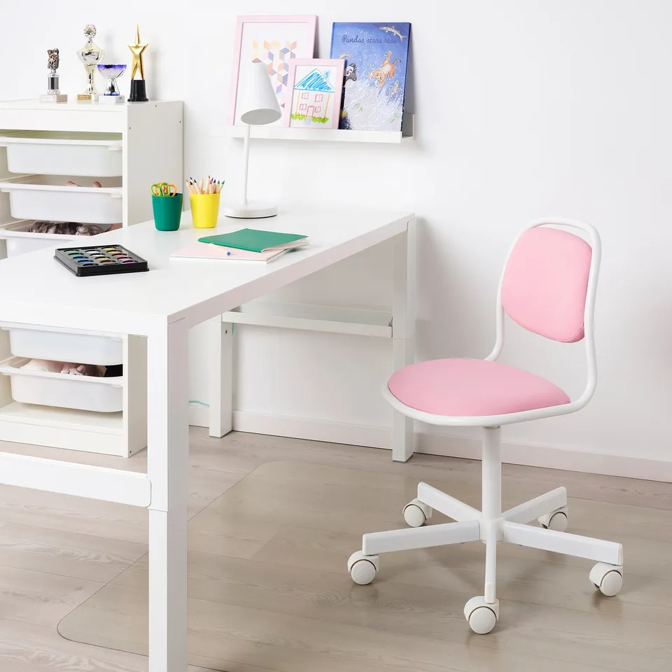 Bright pink & white office chair with cushioned seat & back, 5 caster wheels, under white desk.