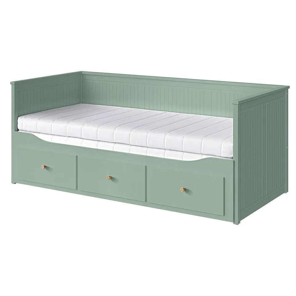 HEMNES green day-bed with storage drawers and white mattress.