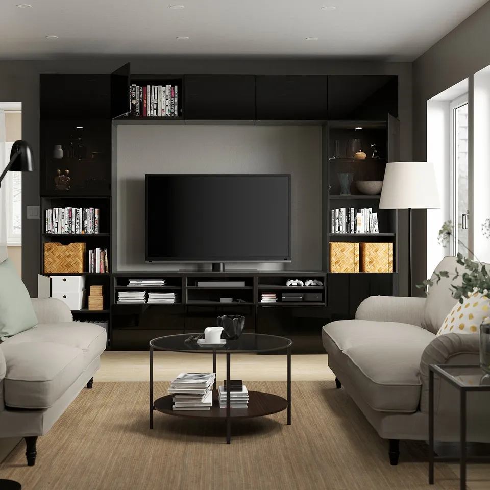 Modern living room with BESTÅ tv unit, featuring adjustable shelves, hidden cable management, and soft-closing drawers and cabinets.