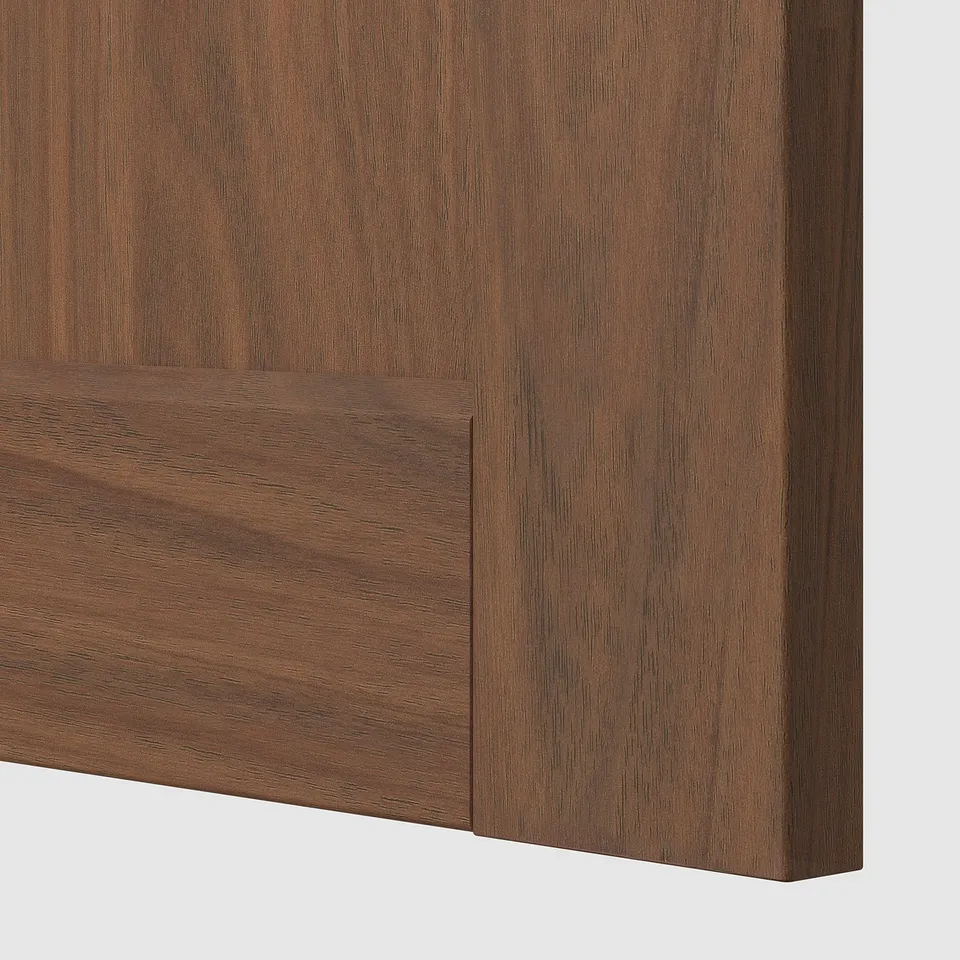 Close-up of smooth, high-quality wooden panel with detailed grain texture, part of modern furniture.