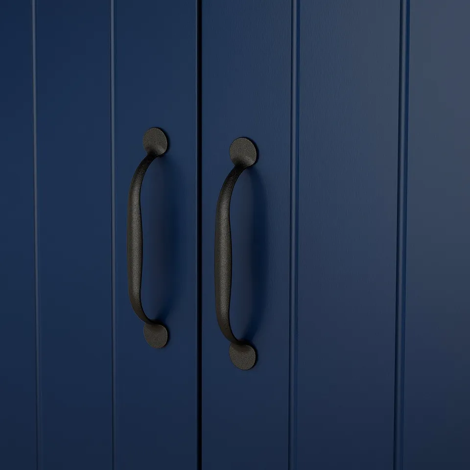 Two navy blue cabinet doors with sleek black curved handles.