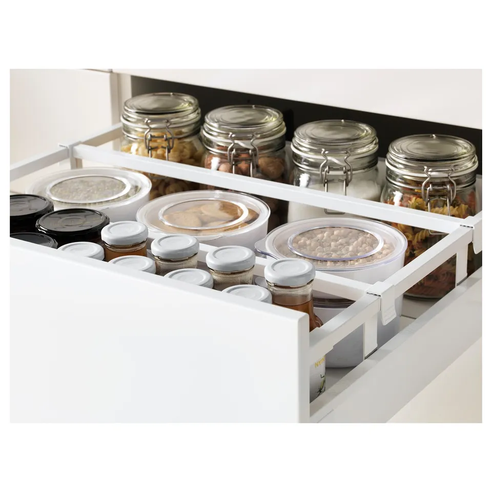 Kitchen cabinet drawer with organised food containers, glass jars, and full-extension feature.