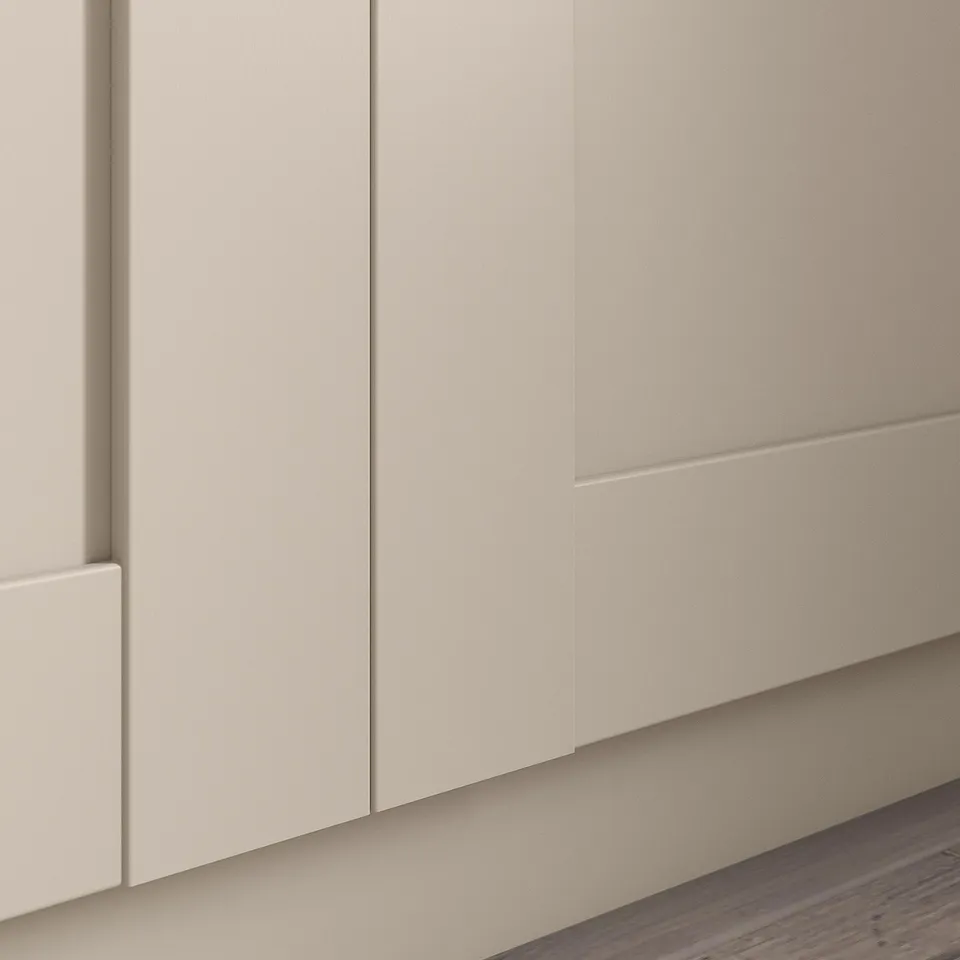 A BERGSBO cabinet door in beige with a sleek, modern design.