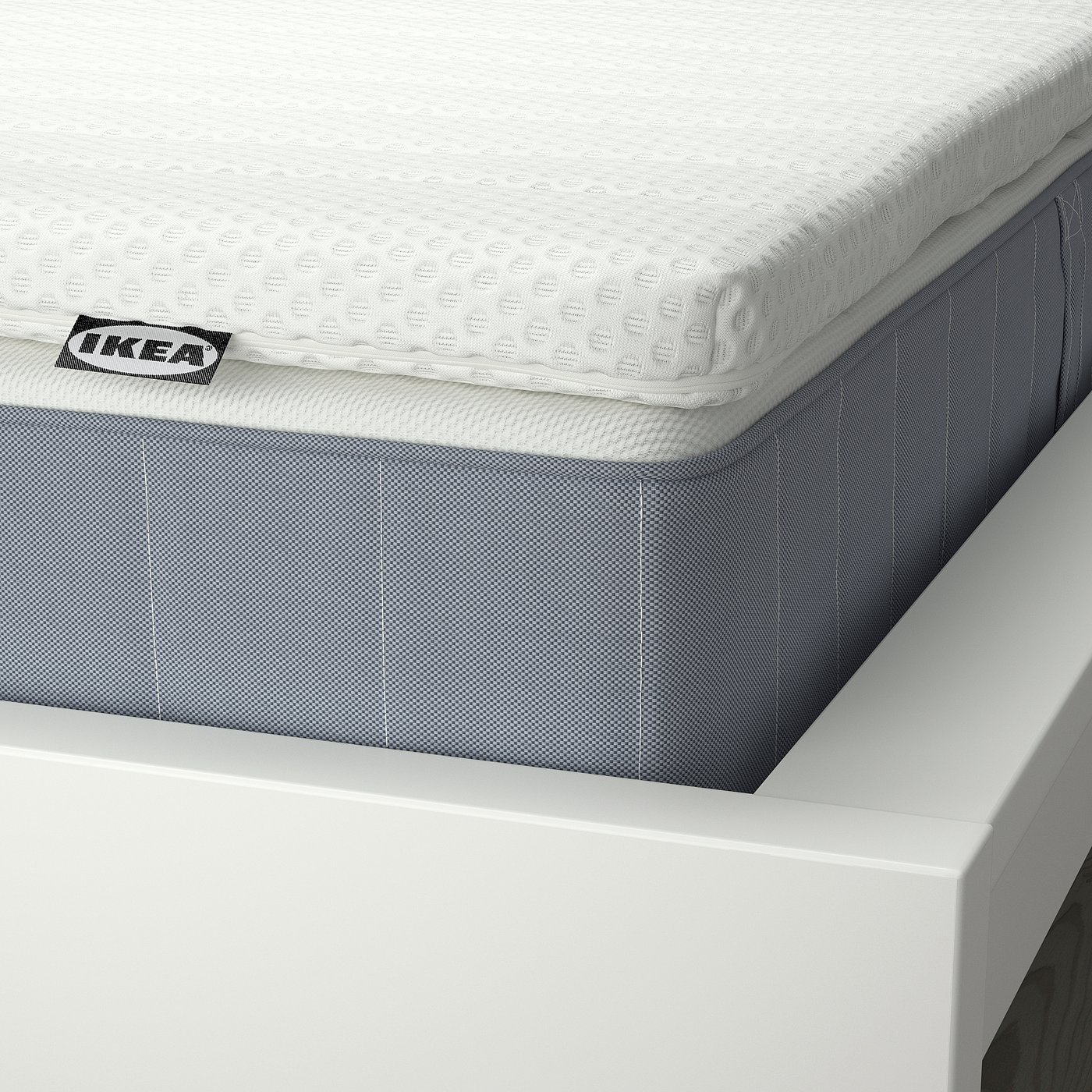 Close-up of ikea mattress and mattress topper, showcasing quality materials and craftsmanship.