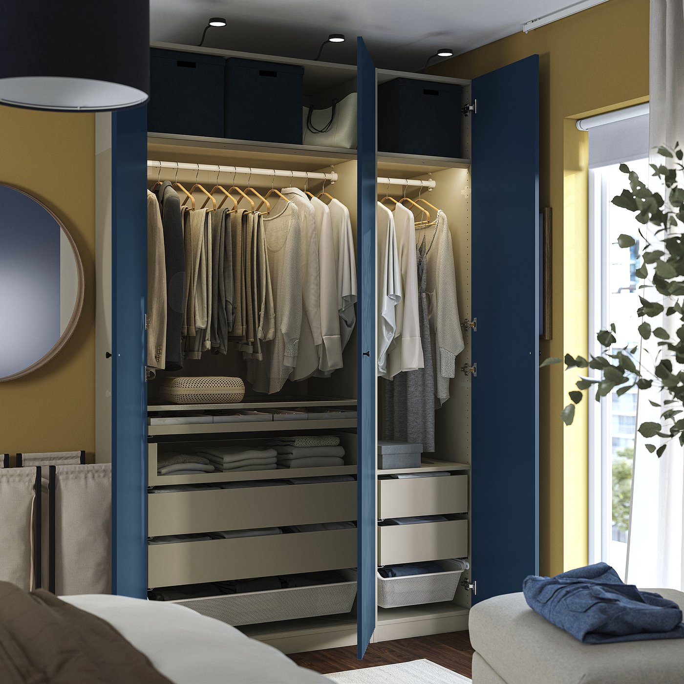 Open blue wardrobe displaying clothes, drawers, storage boxes, and led lights.