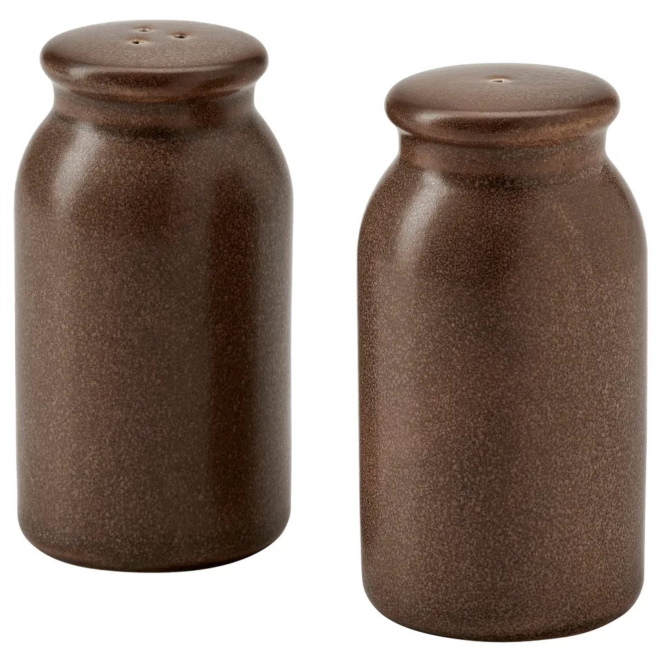 Two brown stoneware spice jars with lids, cylindrical and rustic, perfect for salt and pepper.