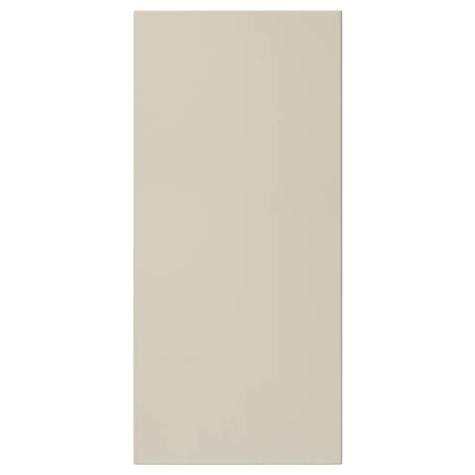 A rectangular beige HAVSTORP front panel. Its smooth, modern, and made from acrylic painted fibreboard.