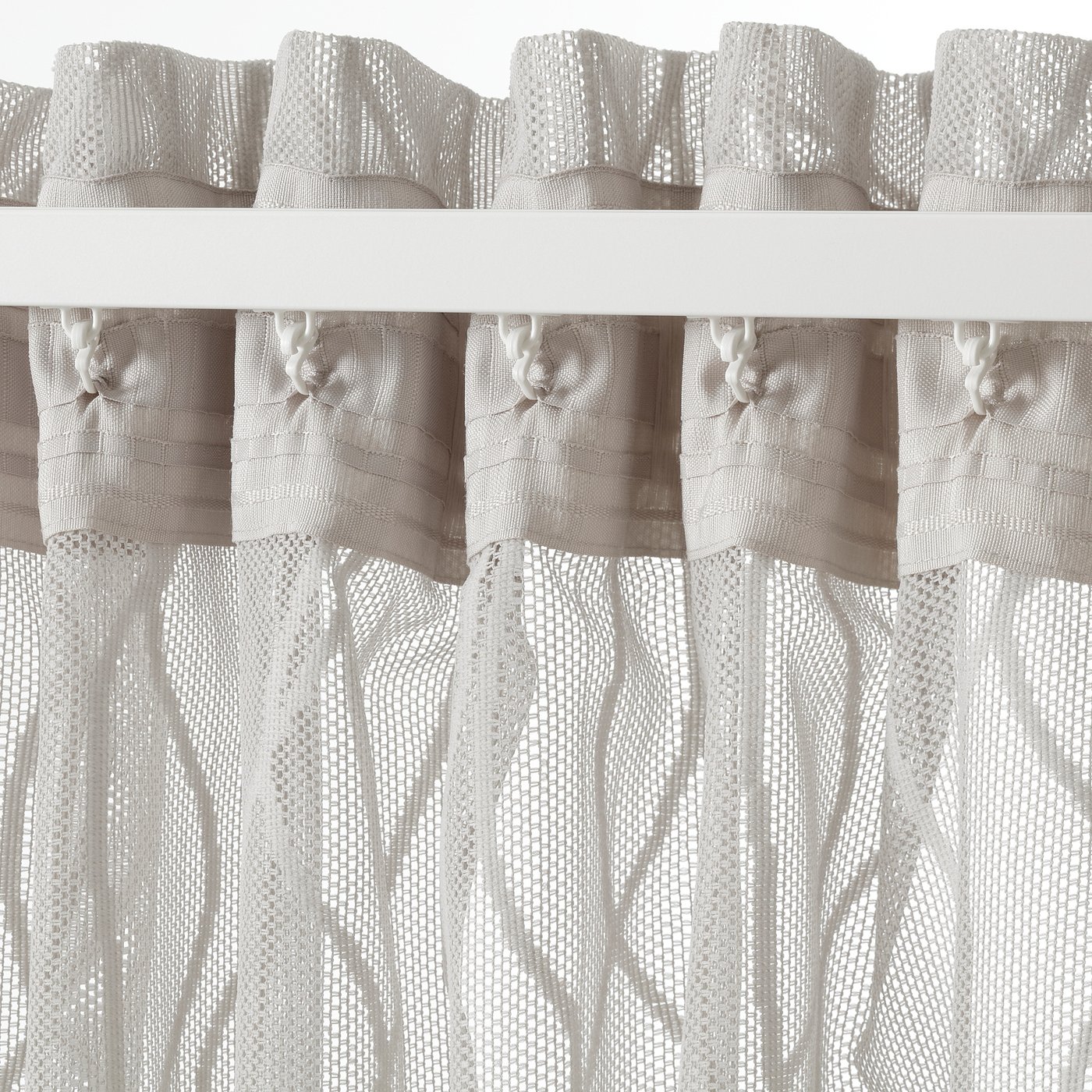 A pair of sheer wave-patterned grey curtains with hanging tabs, designed for privacy and light diffusion in home decor.