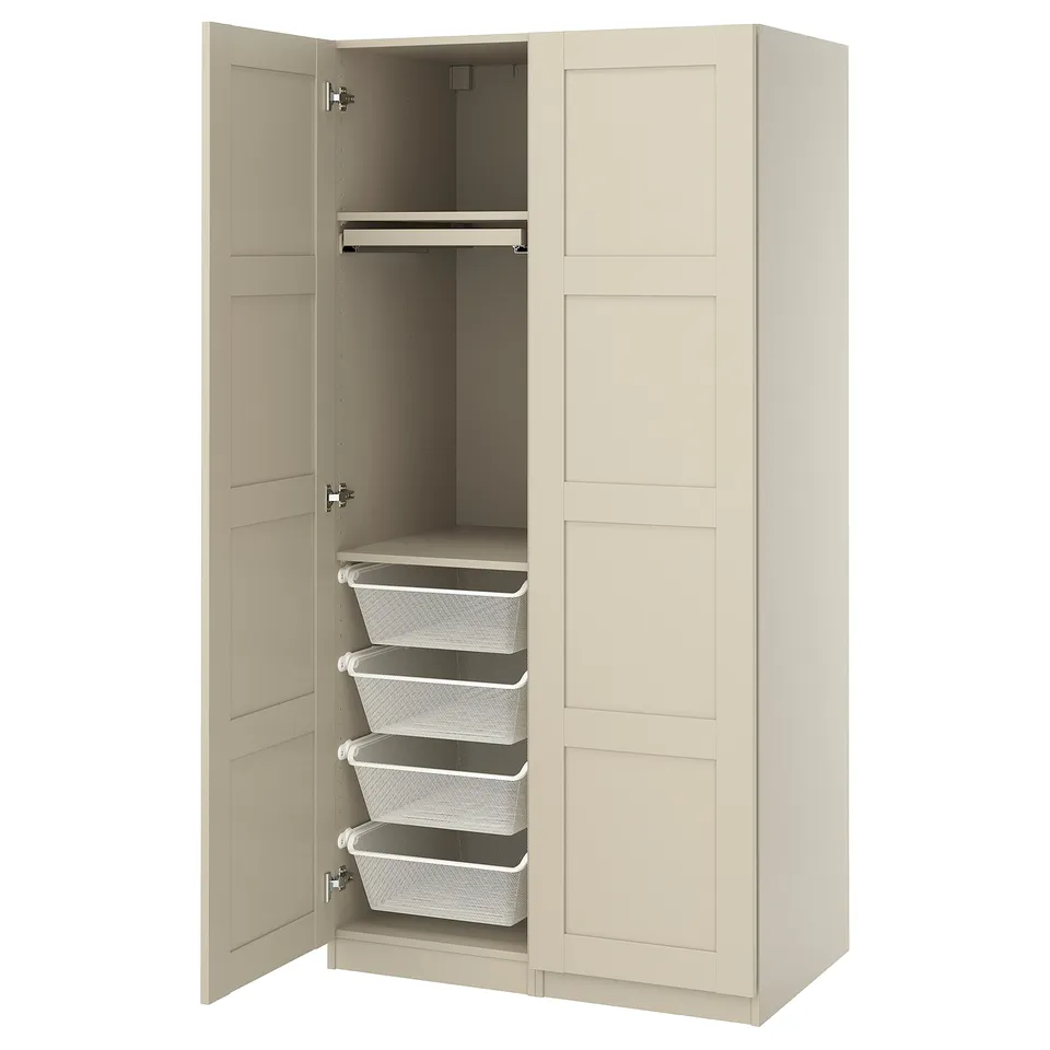 An open beige PAX wardrobe with two doors, containing wire storage baskets and drawers.