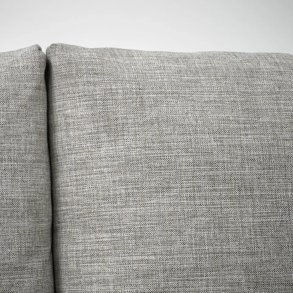 A close-up of a plush, textured grey fabric often seen on high-quality furniture.