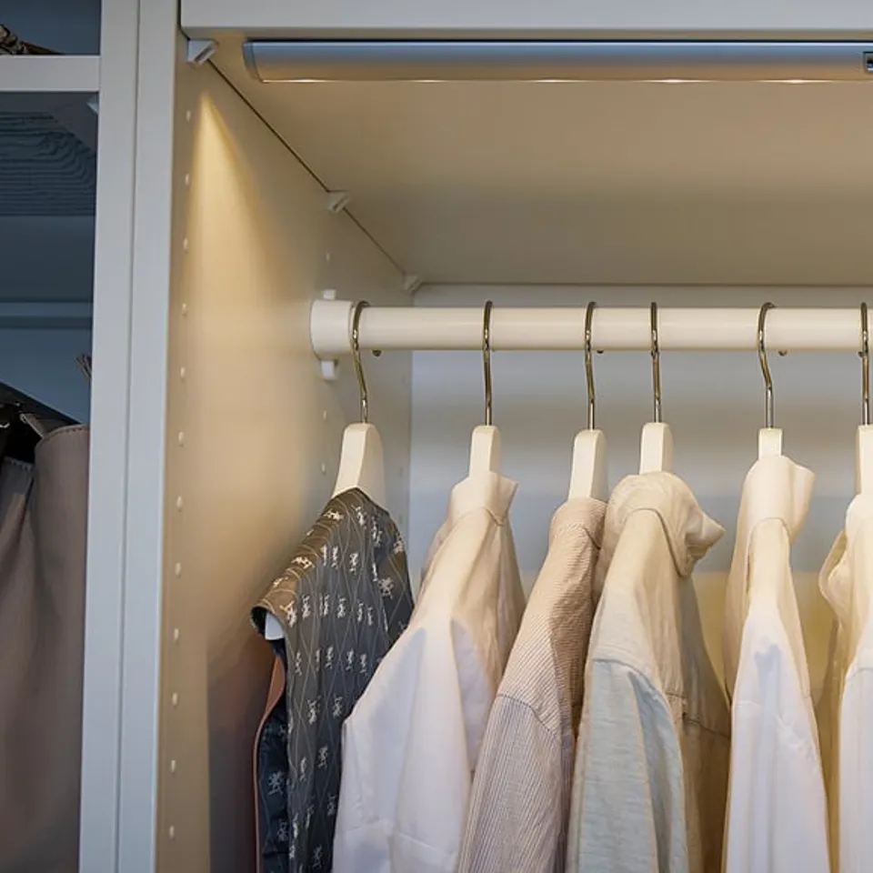 Clothes rail with shirts on hangers
