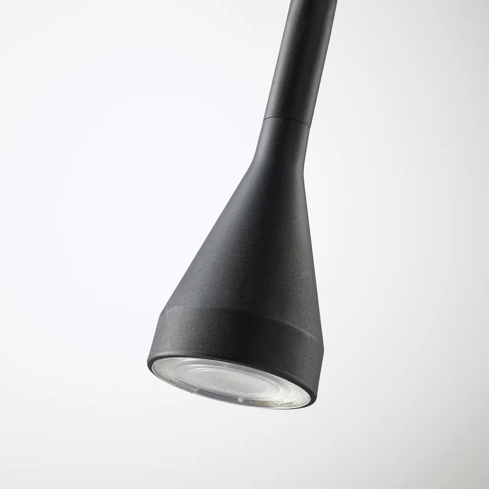 Modern, black adjustable desk lamp with sleek design and effective light diffusion.