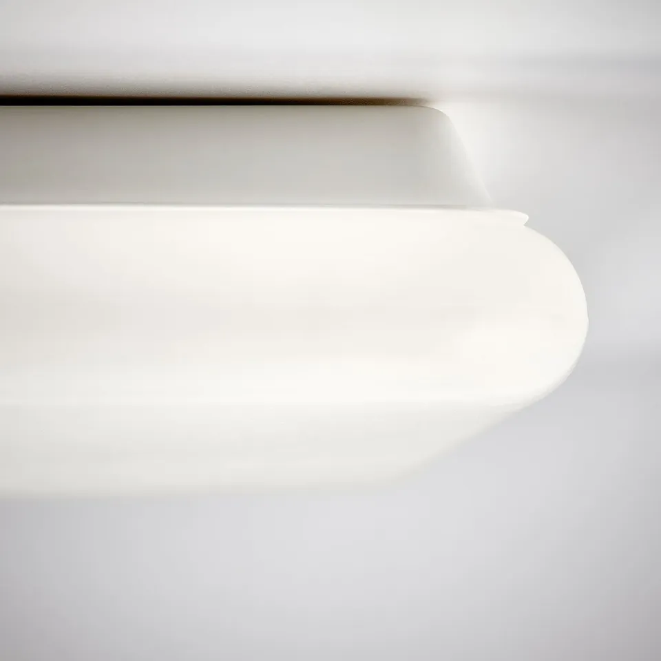 Modern, sleek white light panel, smooth edges, high-quality finish.