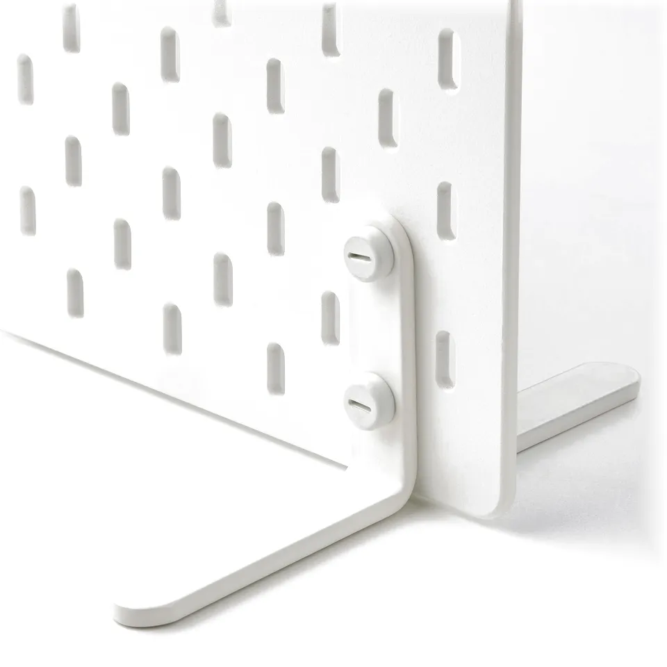 White pegboard with evenly spaced holes and attached metal clips, showcasing robust material and sturdy construction.