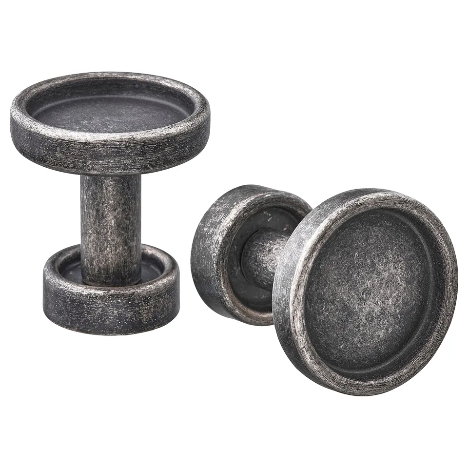 Dark grey metal kitchen handles with round tops, textured surface, and thick design.