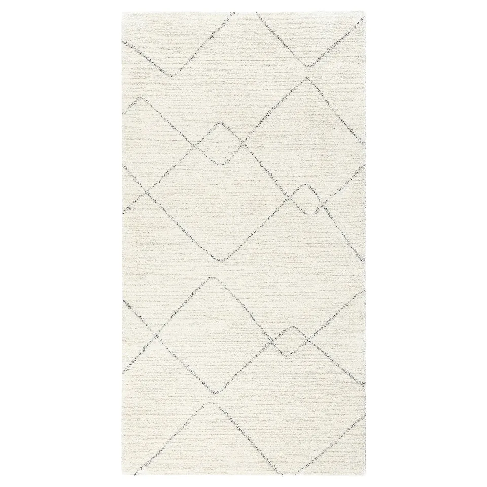 TVERSTED rug. Cream with diamond patterns, rectangular shape. Modern berber-inspired design, soft and stain-resistant.