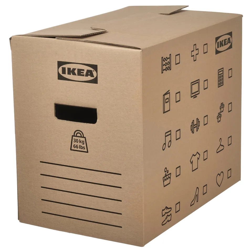 A brown ikea DUNDERGUBBE cardboard moving box, made of recycled materials, with cut-out handles and symbols for identifying contents.