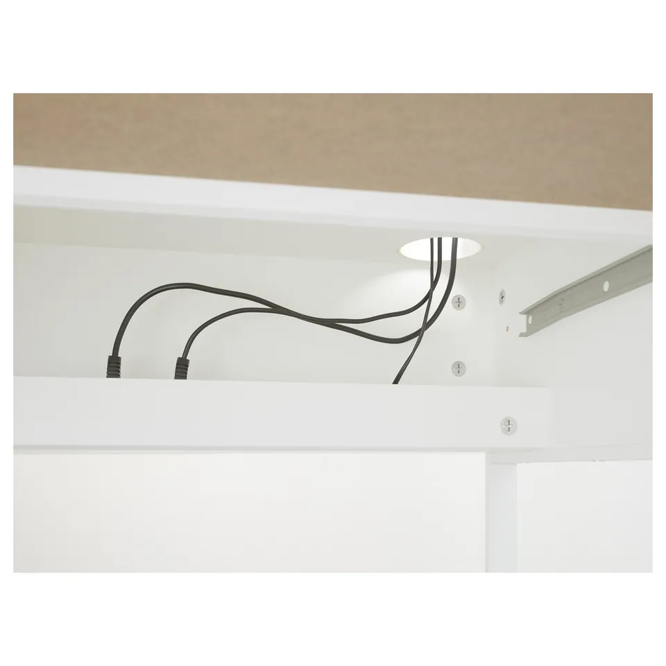 Cord management system on desk, keeping cables out of sight and organised.