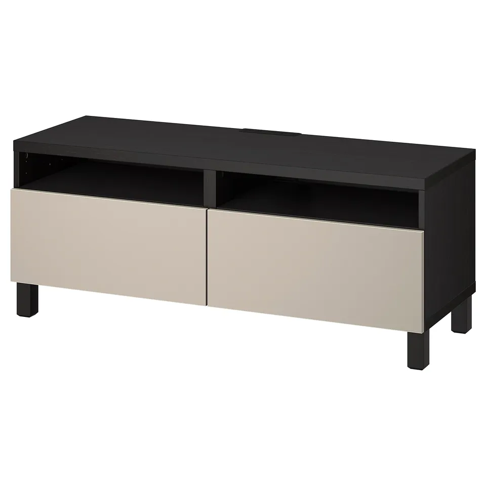 Black and beige tv stand, BESTÅ, with soft-close drawers and cable outlets.