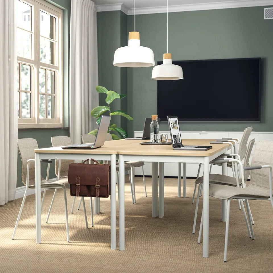 Modern office with LÄKTARE chair, large tv, and big windows.