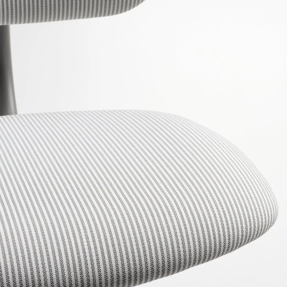 Close-up view of a modern, striped swivel chair, showcasing its padded, curved seat and sleek design.
