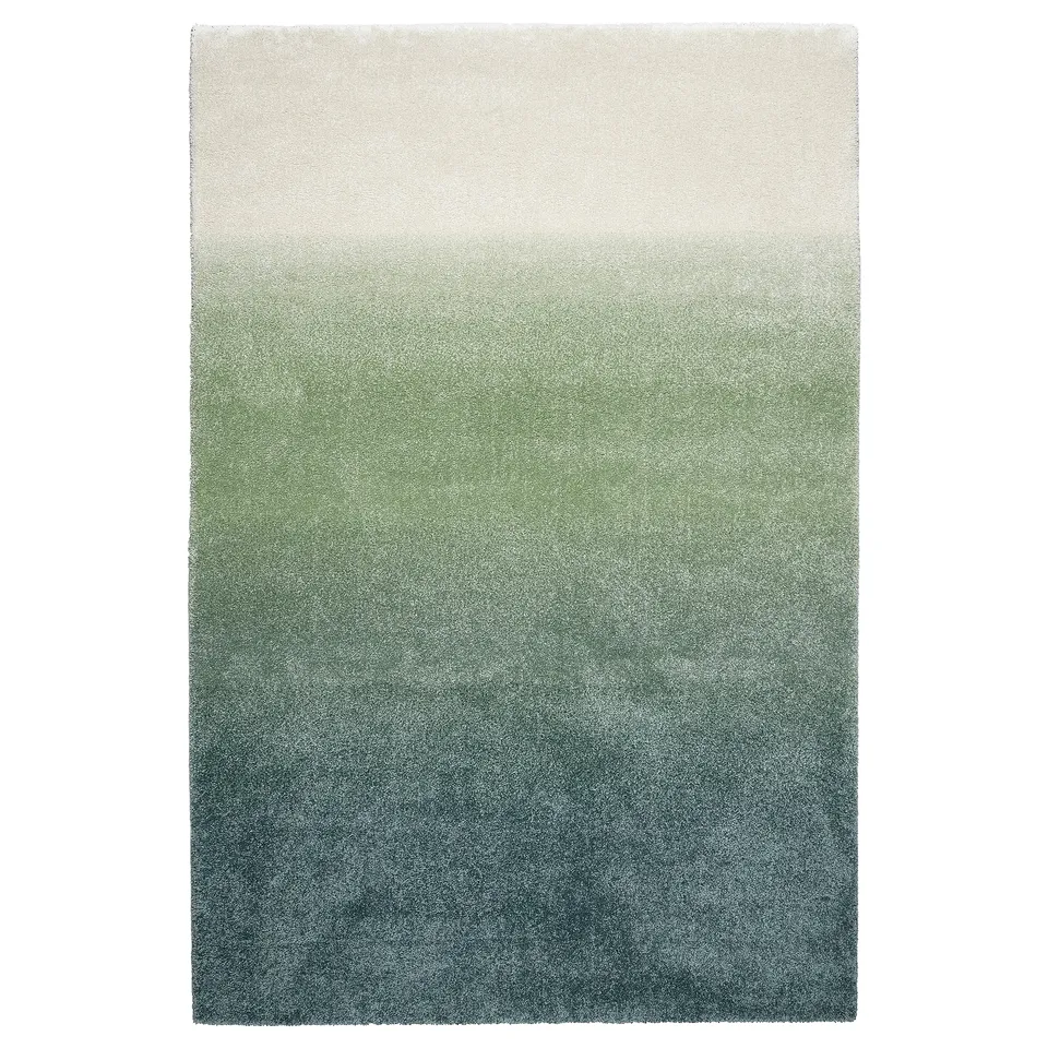 Ombre rug: hotelrum. Blue, green, white. Soft, plush texture. Rectangle shape with gradient design.